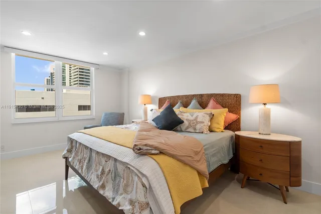 a bedroom with a bed furniture and a window