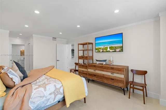 a view of walk in closet with clothes