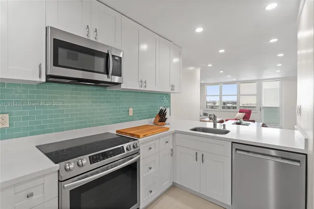 a kitchen with a table and chairs in it