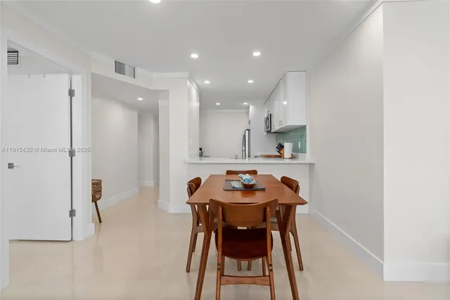 a view of a lobby with furniture and a chandelier