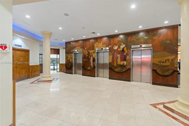 a room with furniture pool table and rug