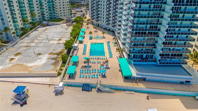 a view of swimming pool from a balcony