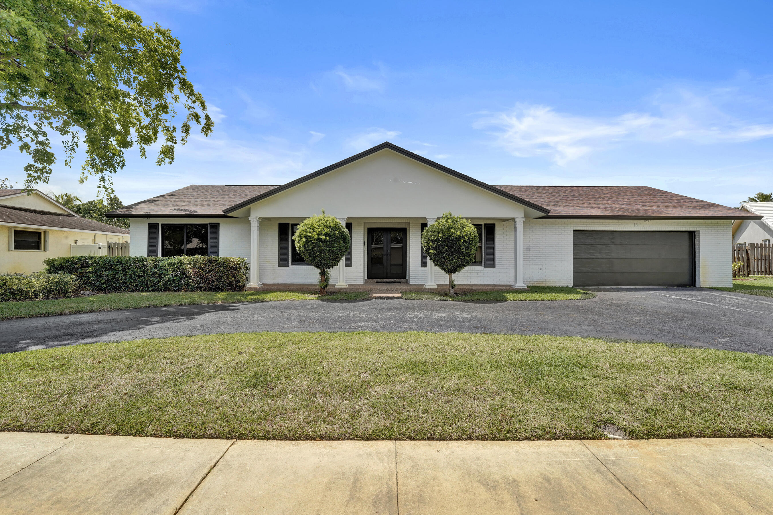 1321 Southwest 74th Terrace Plantation, FL 33317 - Photo 12 of 59 a front view of house with yard and green space