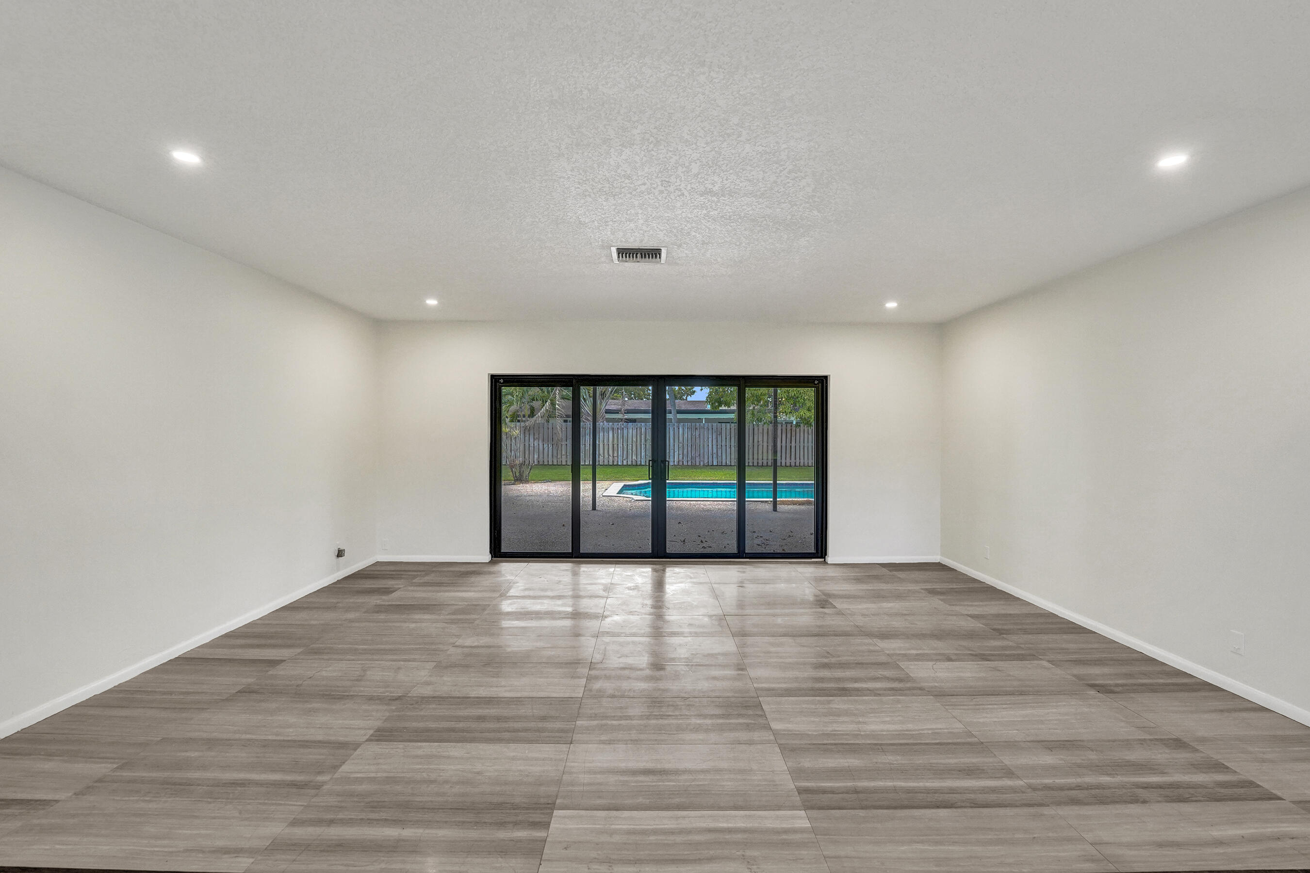 1321 Southwest 74th Terrace Plantation, FL 33317 - Photo 18 of 59 a view of an empty room with wooden floor