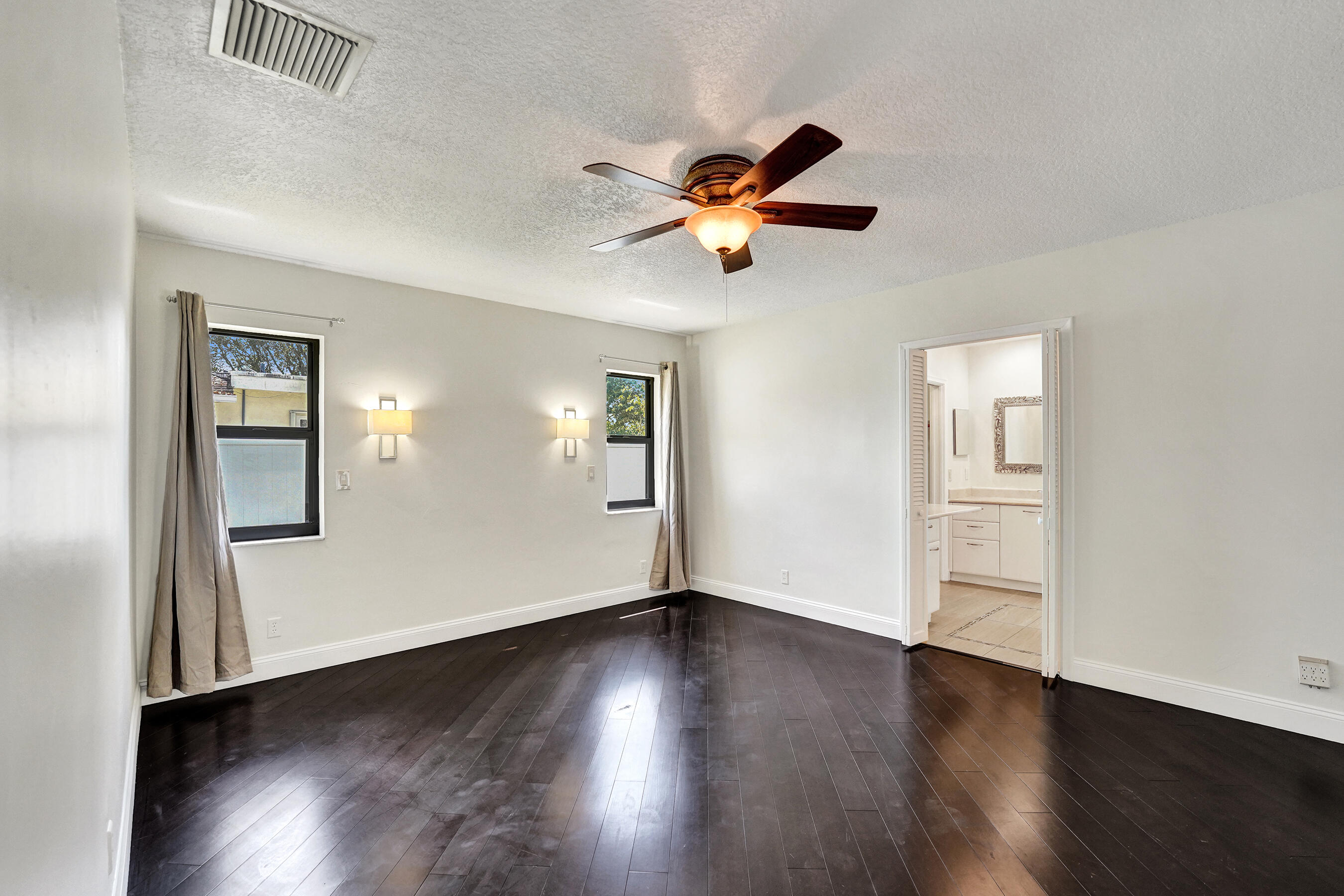 1321 Southwest 74th Terrace Plantation, FL 33317 - Photo 28 of 59 a view of empty room with wooden floor and fan