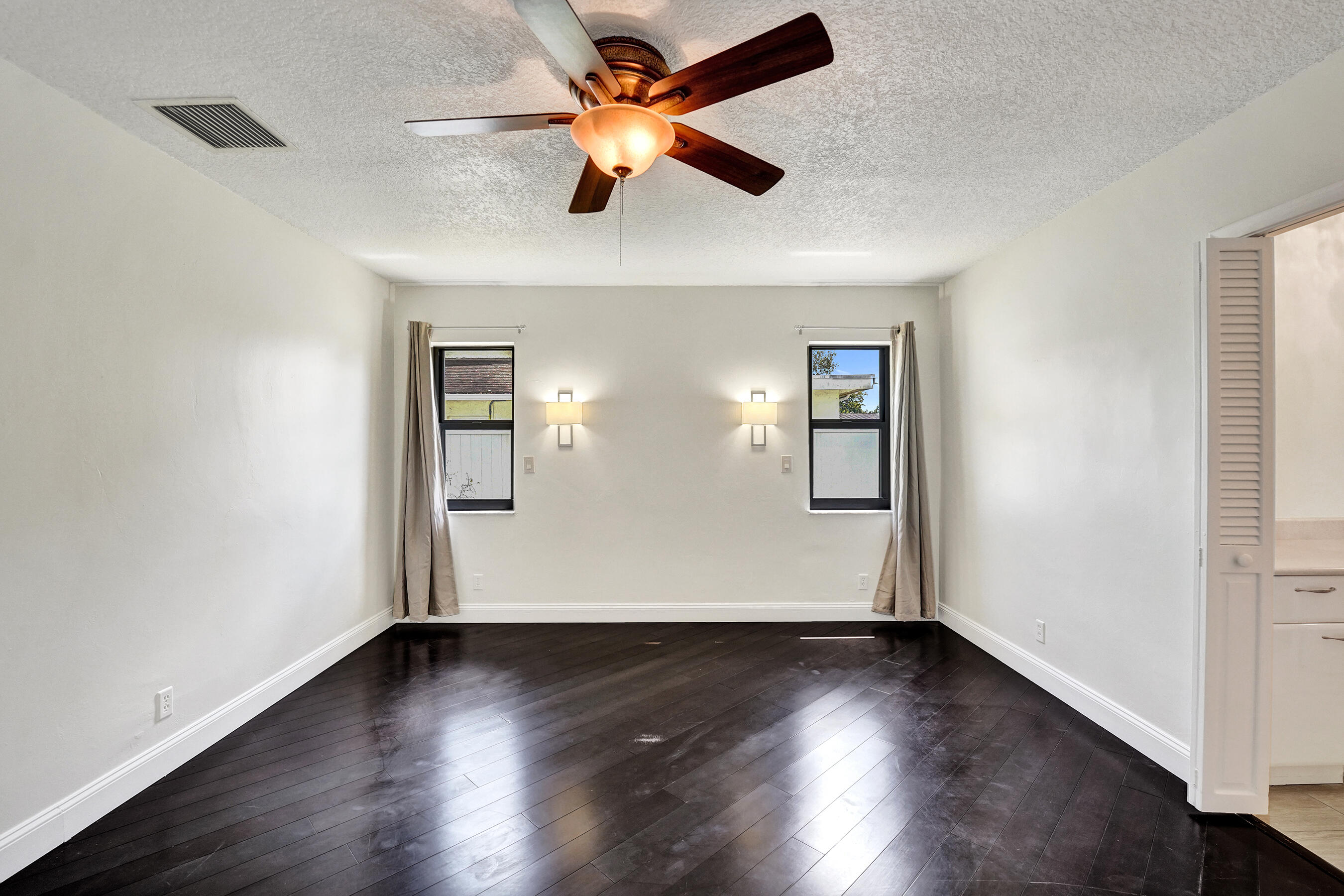 1321 Southwest 74th Terrace Plantation, FL 33317 - Photo 29 of 59 a view of empty room with wooden floor