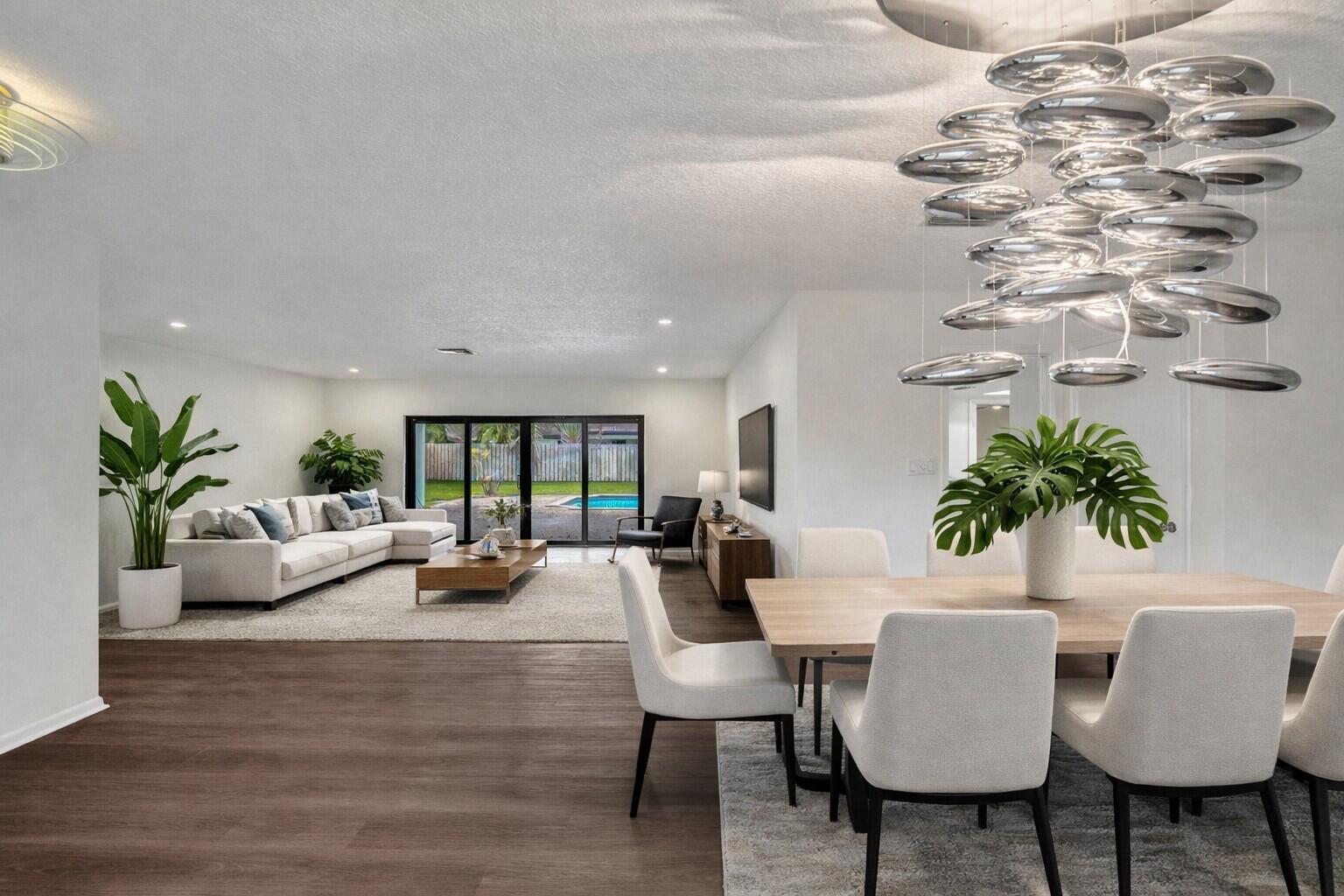 1321 Southwest 74th Terrace Plantation, FL 33317 - Photo 3 of 59 a living room with furniture kitchen view and a potted plant