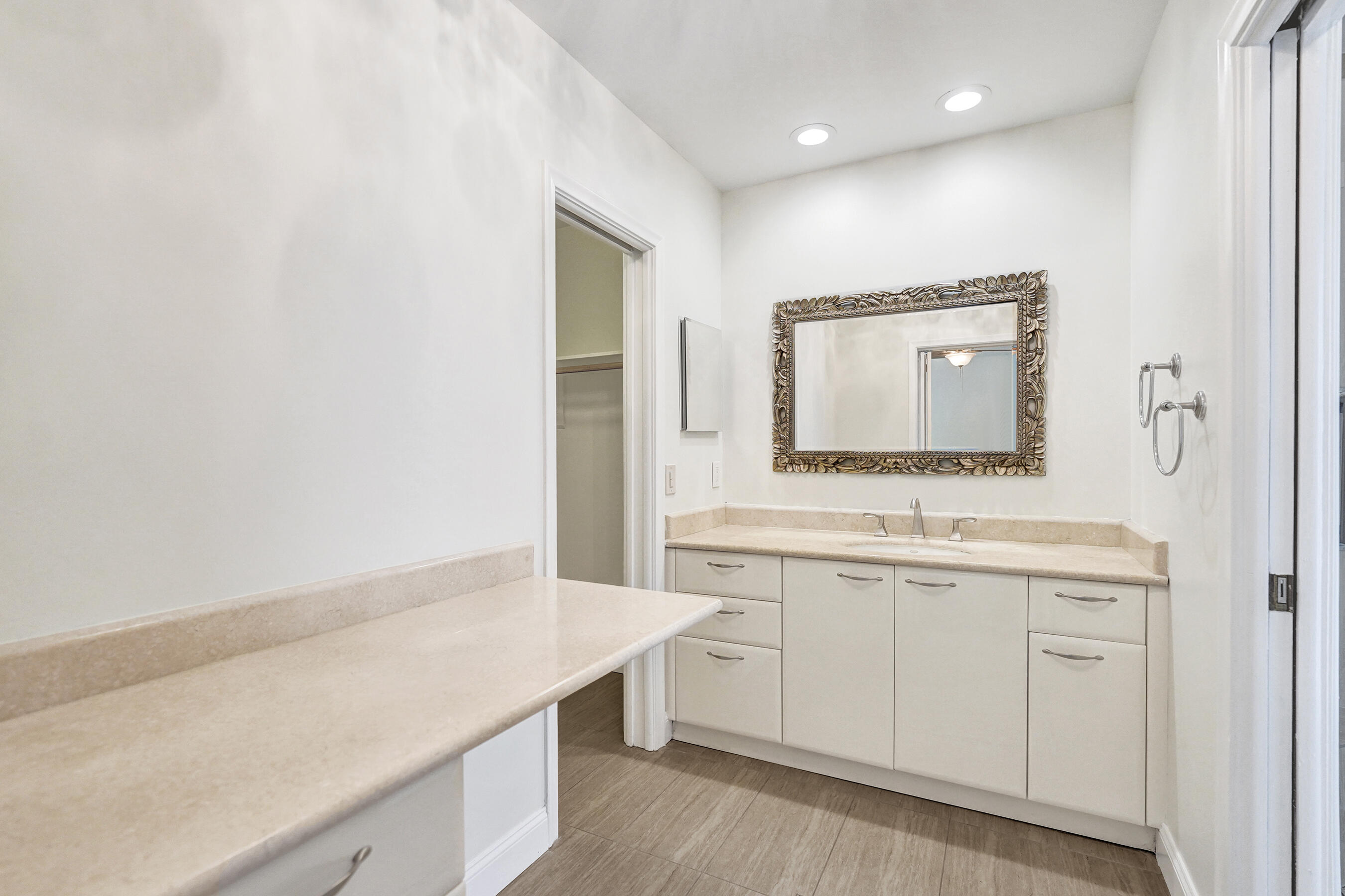 1321 Southwest 74th Terrace Plantation, FL 33317 - Photo 32 of 59 a bathroom with a sink and a mirror