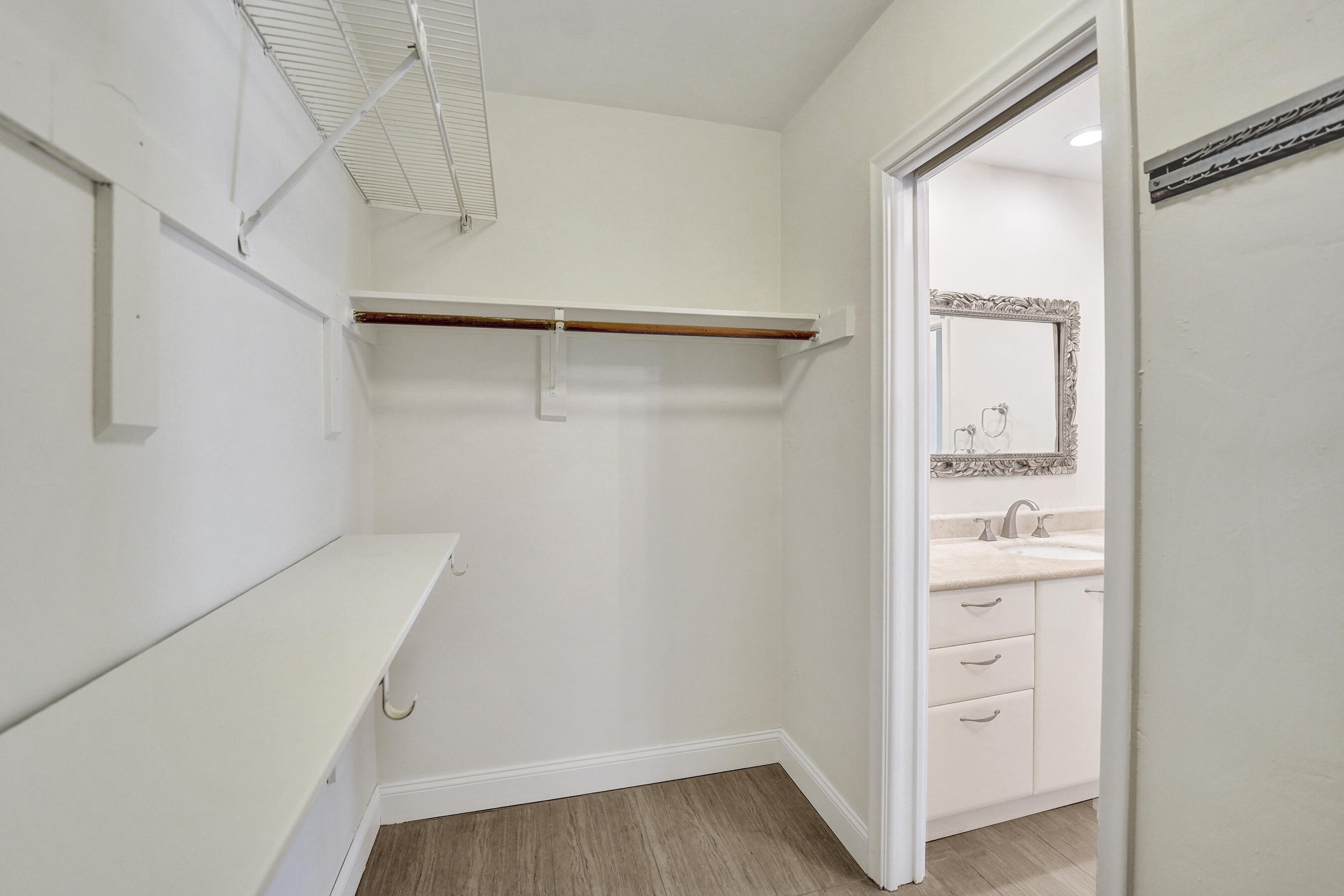 1321 Southwest 74th Terrace Plantation, FL 33317 - Photo 34 of 59 a view of walk in closet with empty racks