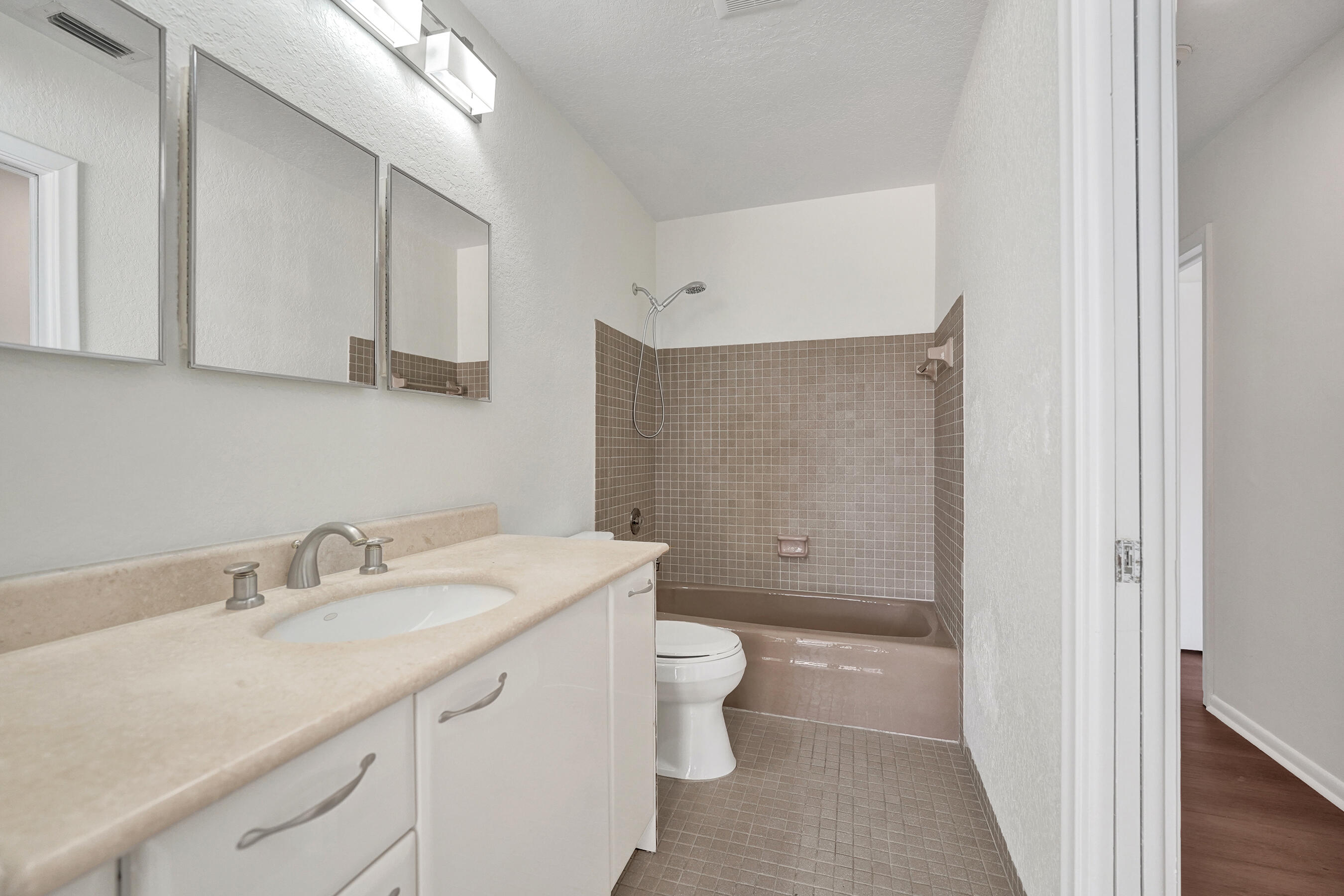 1321 Southwest 74th Terrace Plantation, FL 33317 - Photo 40 of 59 a bathroom with a sink a toilet and shower