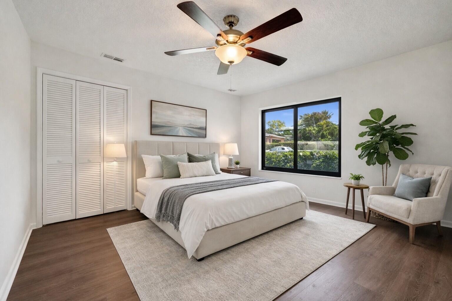 1321 Southwest 74th Terrace Plantation, FL 33317 - Photo 4 of 59 a bedroom with a large bed chandelier and a window