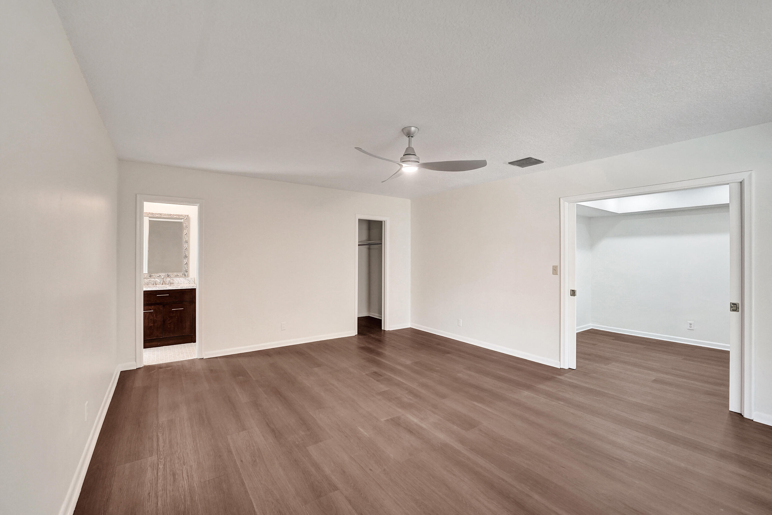 1321 Southwest 74th Terrace Plantation, FL 33317 - Photo 47 of 59 a view of an empty room with wooden floor and a window