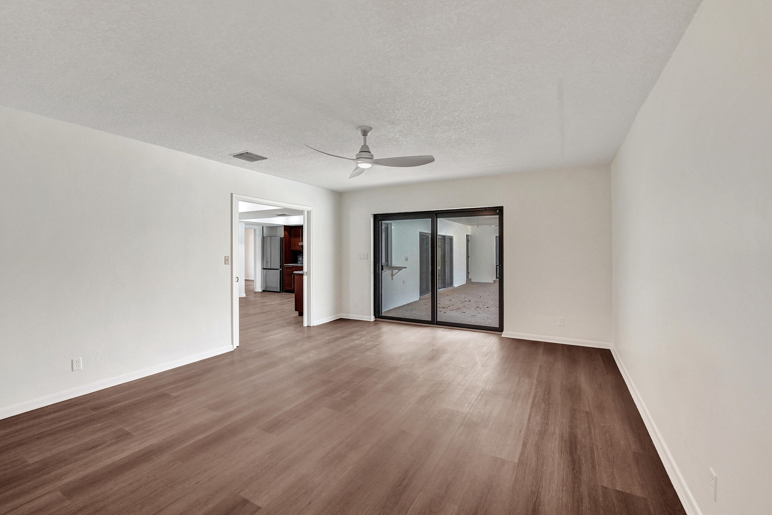 1321 Southwest 74th Terrace Plantation, FL 33317 - Photo 48 of 59 a view of an empty room with wooden floor