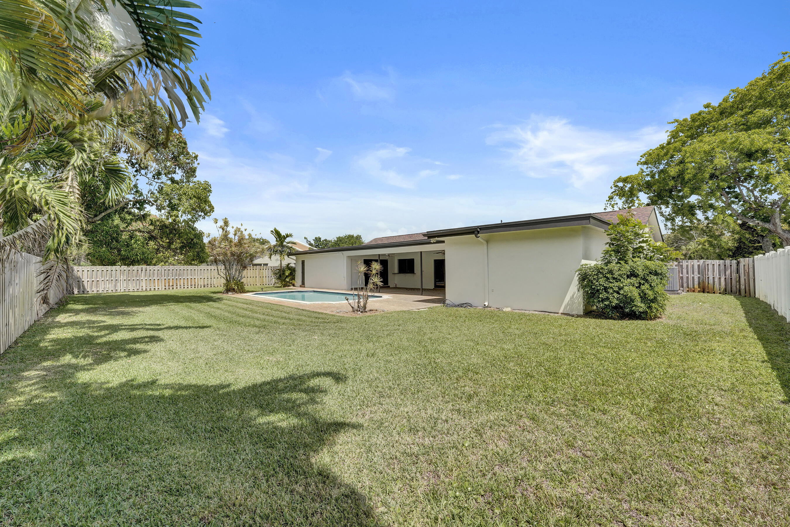 1321 Southwest 74th Terrace Plantation, FL 33317 - Photo 58 of 59 a house with huge green field in front of it