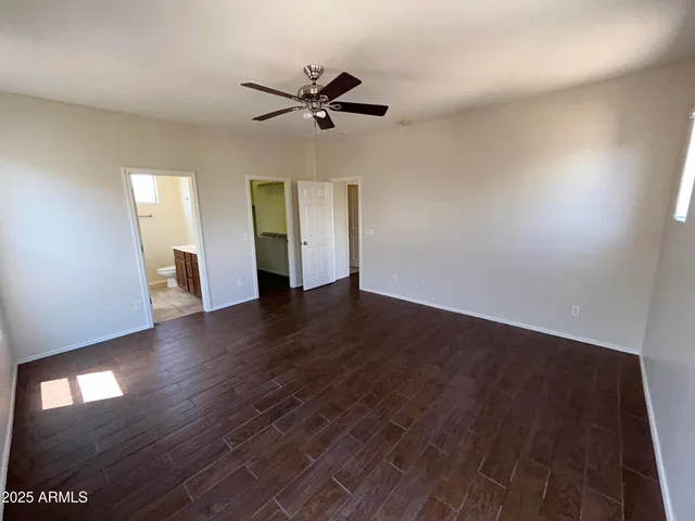 a bathroom with a double vanity sink mirror and toilet