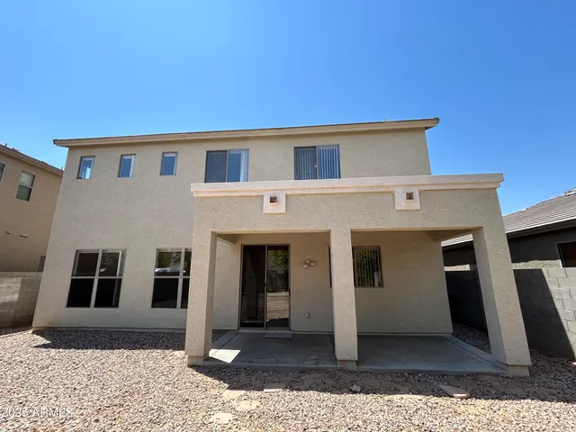 a front view of a house with glass windows