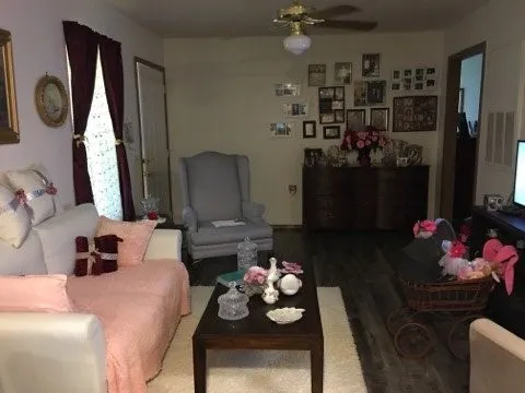 a living room with furniture and a mirror