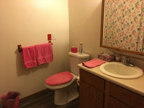 500 Danville Road Kilgore, TX 75662 - Photo 22 of 22 a bathroom with a sink a toilet and a mirror