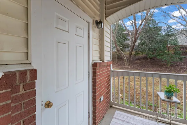 a view of a balcony with wooden floor