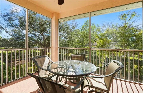 a view of a chair and table in the balcony