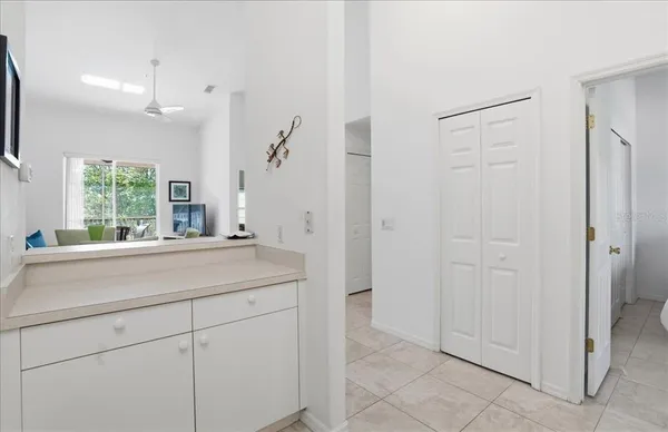 a bathroom with a sink and mirror with bathtub