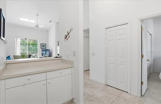 a bathroom with a sink and mirror with bathtub