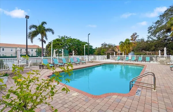 a view of a swimming pool with a patio