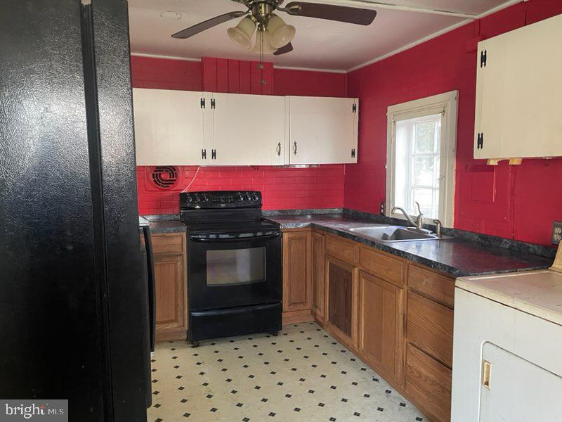 5745 Blaine Road Churchton, MD 20733 - Photo 7 of 9 a kitchen with stainless steel appliances a stove and a sink