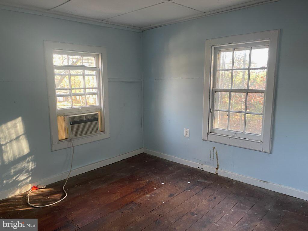 5745 Blaine Road Churchton, MD 20733 - Photo 9 of 9 an empty room with wooden floor and windows
