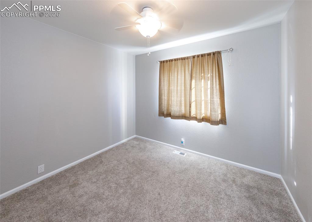 12940 Casa De Campo Road Peyton, CO 80831 - Photo 23 of 50 an empty room with windows and closet