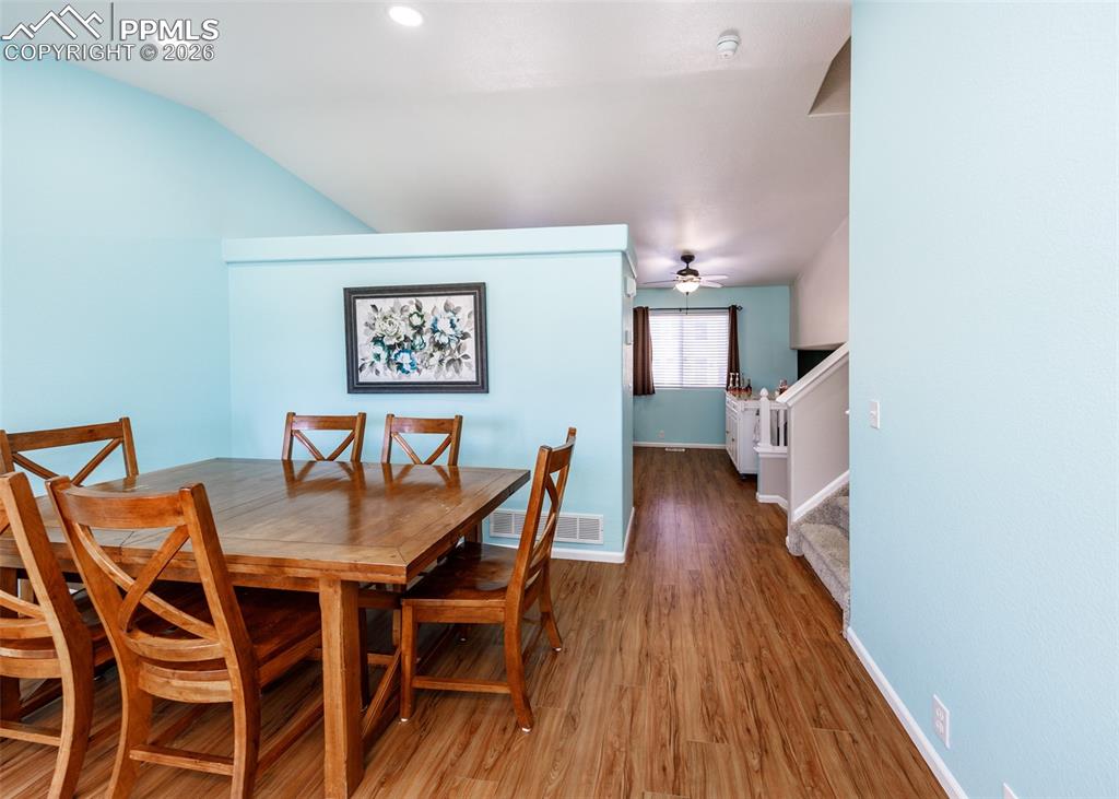 12940 Casa De Campo Road Peyton, CO 80831 - Photo 8 of 50 a view of a dining room with furniture and wooden floor