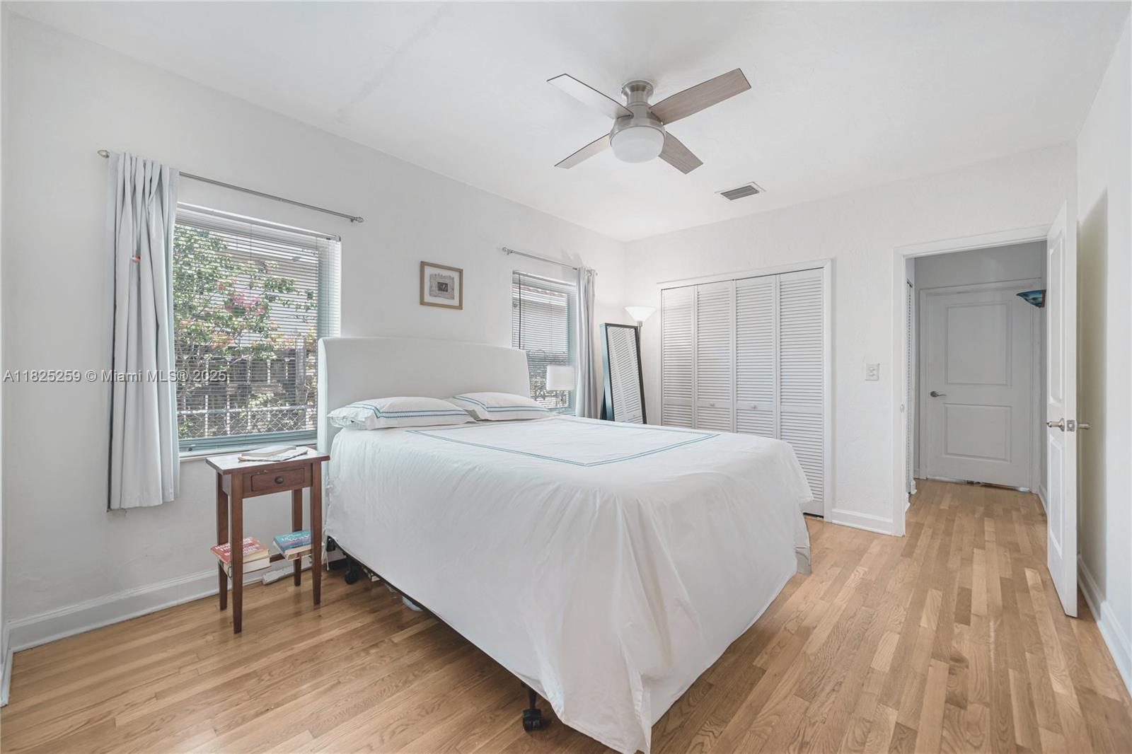 443 Southwest 18th Road Miami, FL 33129 - Photo 15 of 26 a spacious bedroom with a bed and a table