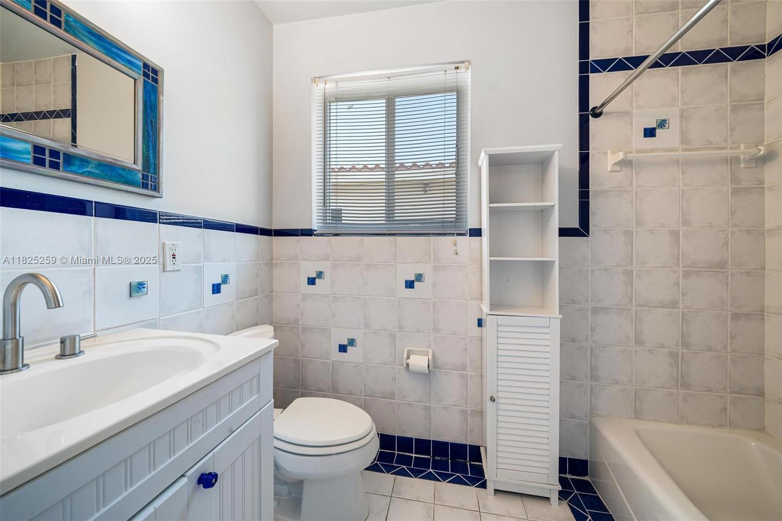 443 Southwest 18th Road Miami, FL 33129 - Photo 19 of 26 a bathroom with a sink toilet and shower