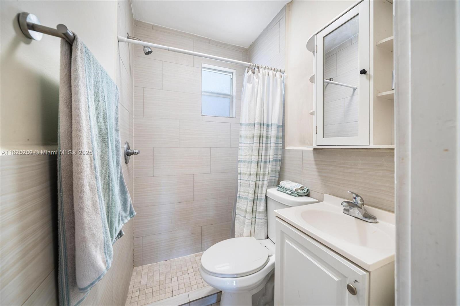 443 Southwest 18th Road Miami, FL 33129 - Photo 23 of 26 a bathroom with a sink toilet and shower