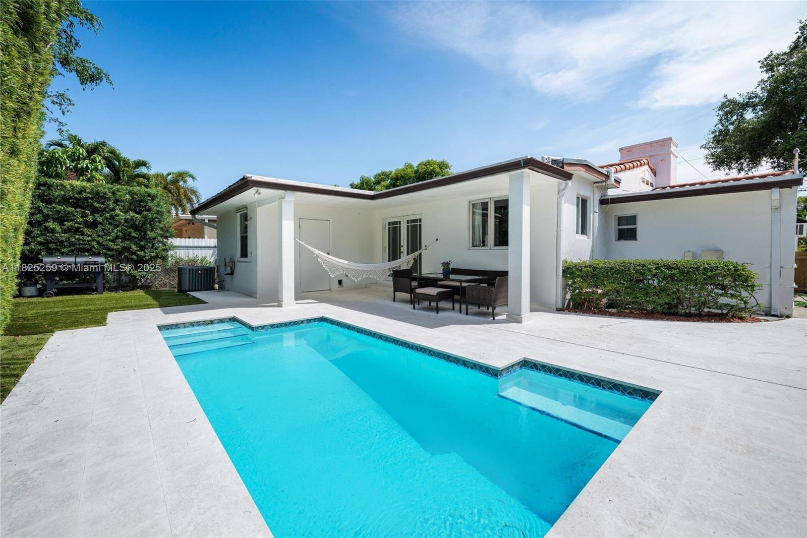 443 Southwest 18th Road Miami, FL 33129 - Photo 3 of 26 a view of a house with backyard porch and sitting area
