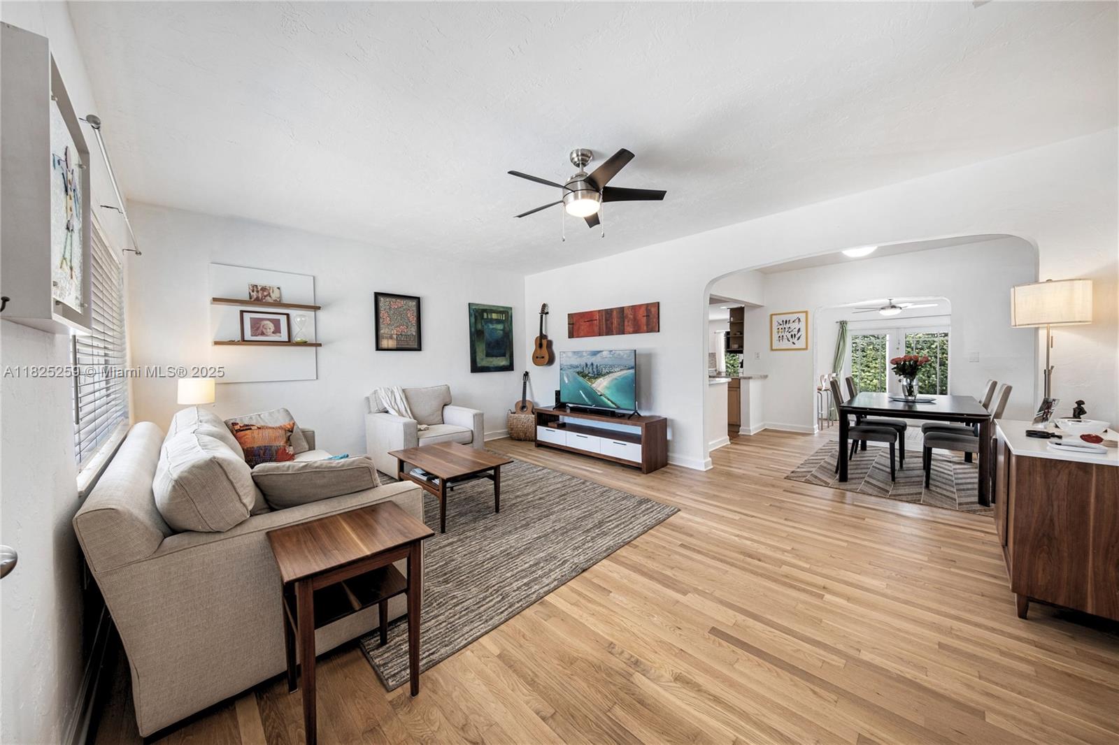 443 Southwest 18th Road Miami, FL 33129 - Photo 7 of 26 a living room with furniture and a wooden floor