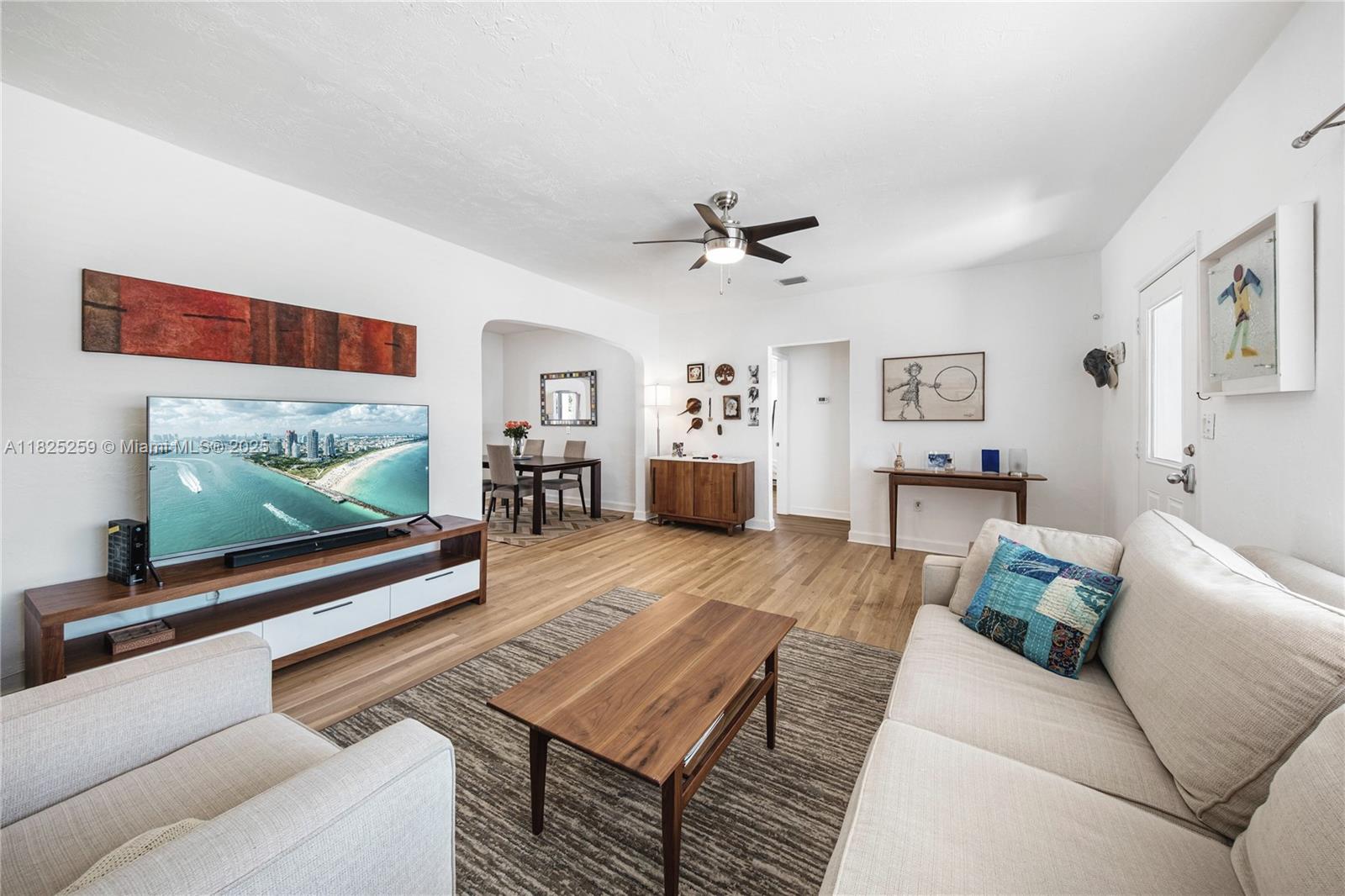 443 Southwest 18th Road Miami, FL 33129 - Photo 8 of 26 a living room with furniture and a flat screen tv