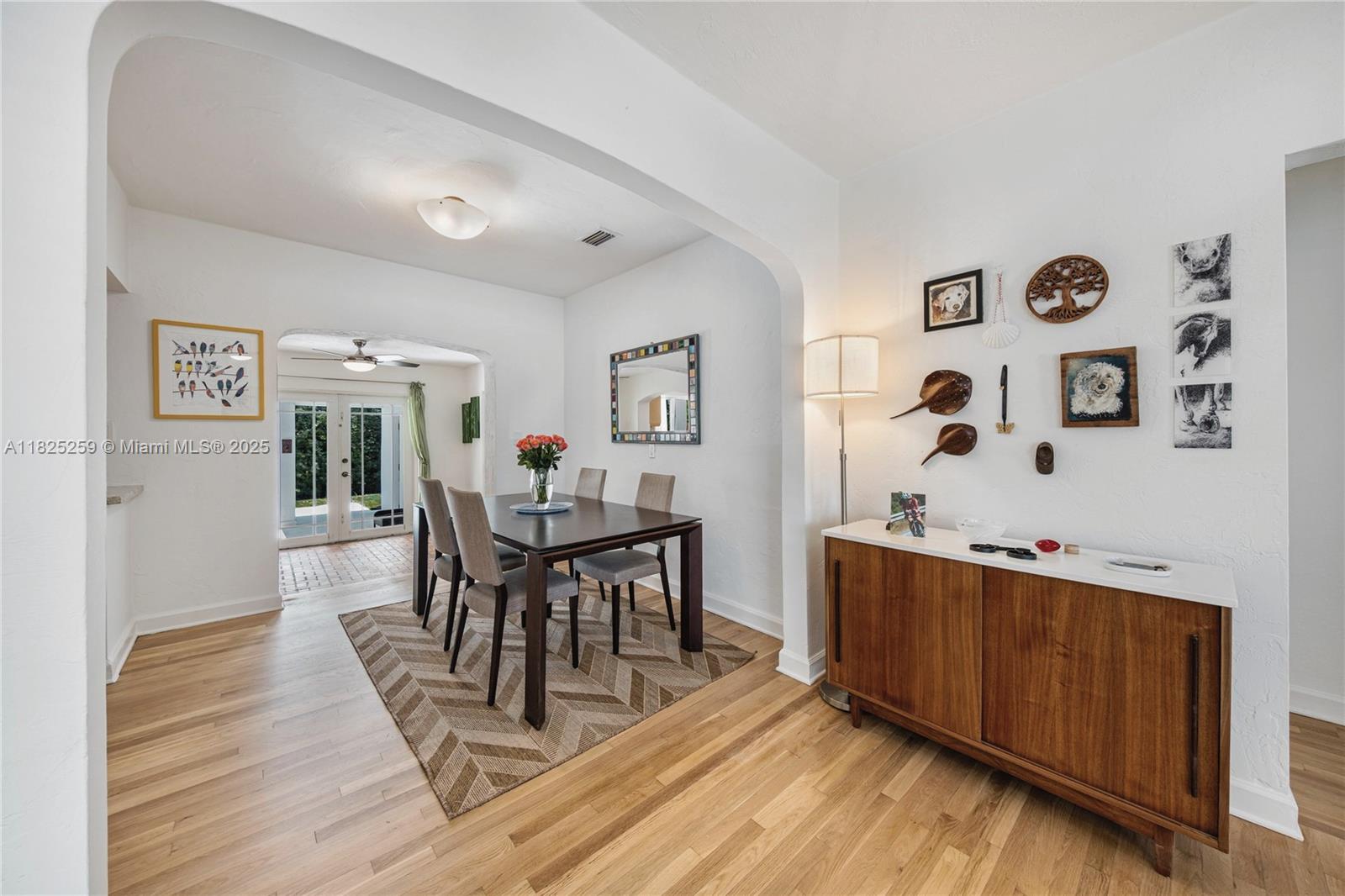443 Southwest 18th Road Miami, FL 33129 - Photo 10 of 26 a view of a dining room with furniture and wooden floor