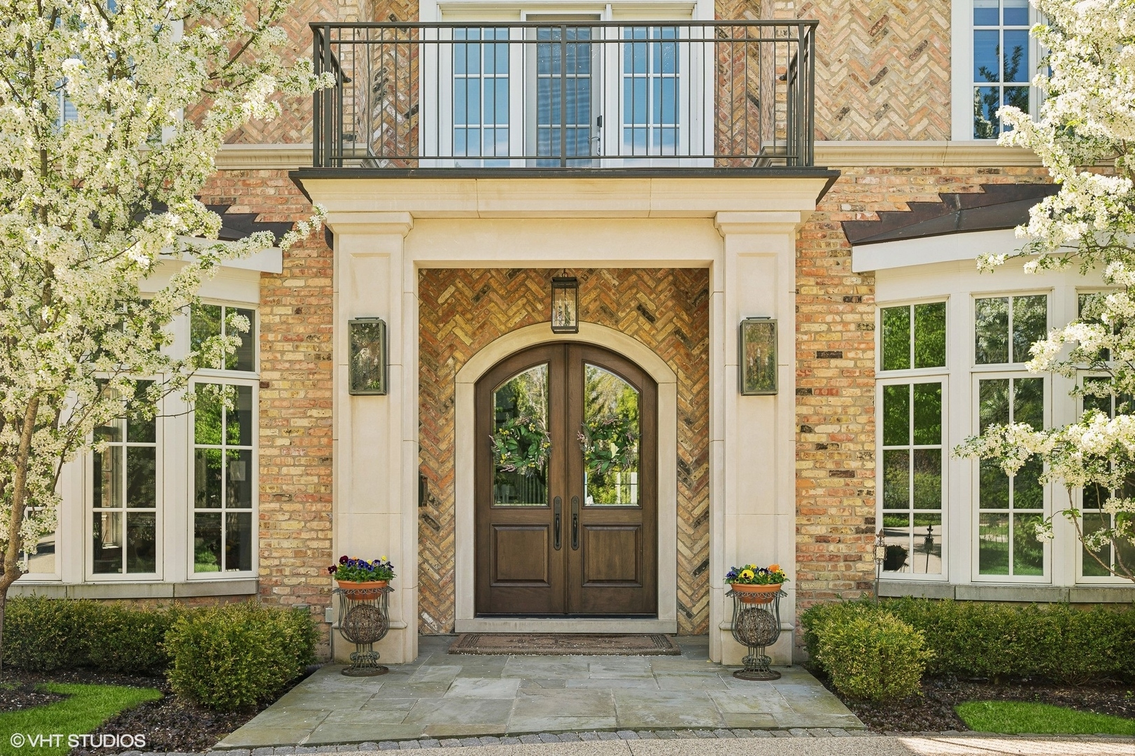 1228 Westmoor Road Winnetka, IL 60093 - Photo 3 of 70 front view of a brick house with a entrance
