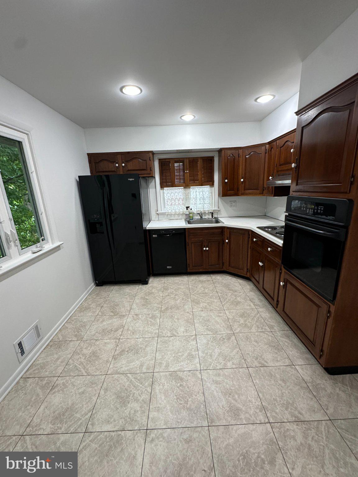 3527 Ridgeway Road Harrisburg, PA 17109 - Photo 55 of 55 Modern kitchen with rich wood accents.