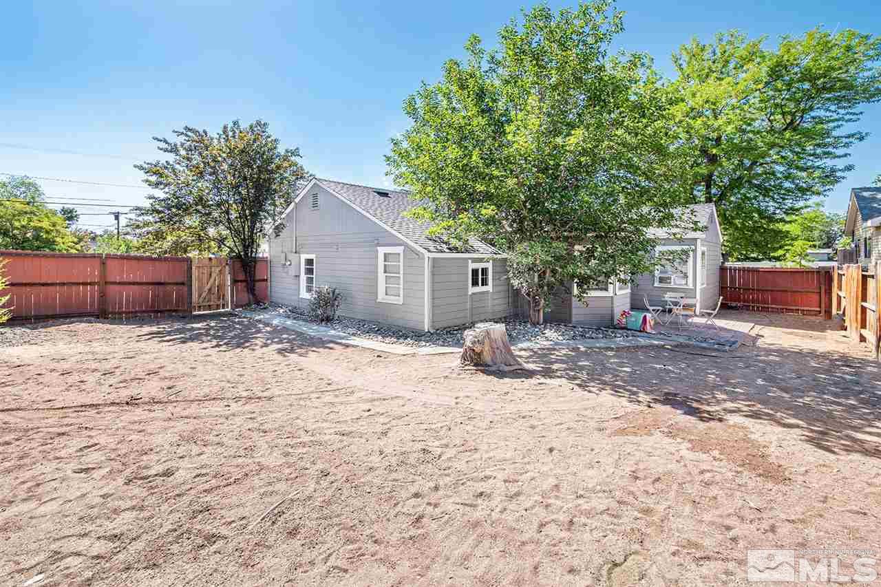 1201 Ralston Street Reno, NV 89503 - Photo 4 of 8 a view of a house with a yard and wooden fence