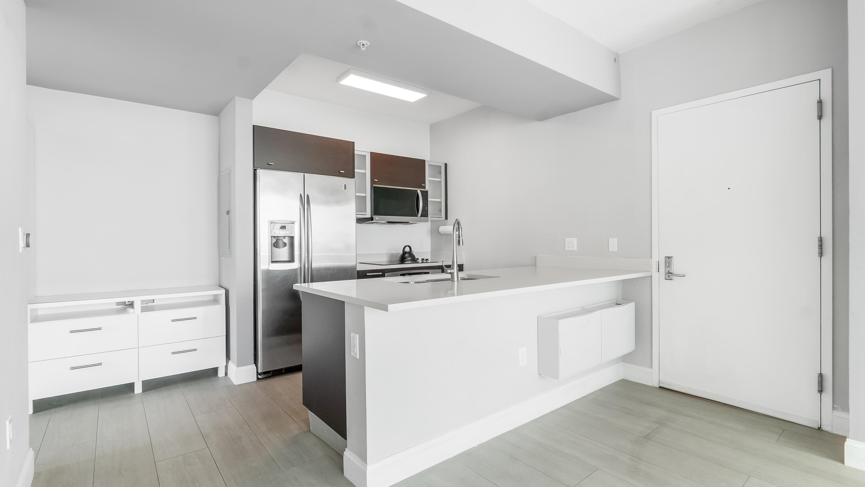 333 Northeast 24th Street, Unit 1102 Miami, FL 33137 - Photo 12 of 51 a kitchen with cabinets a sink and appliances