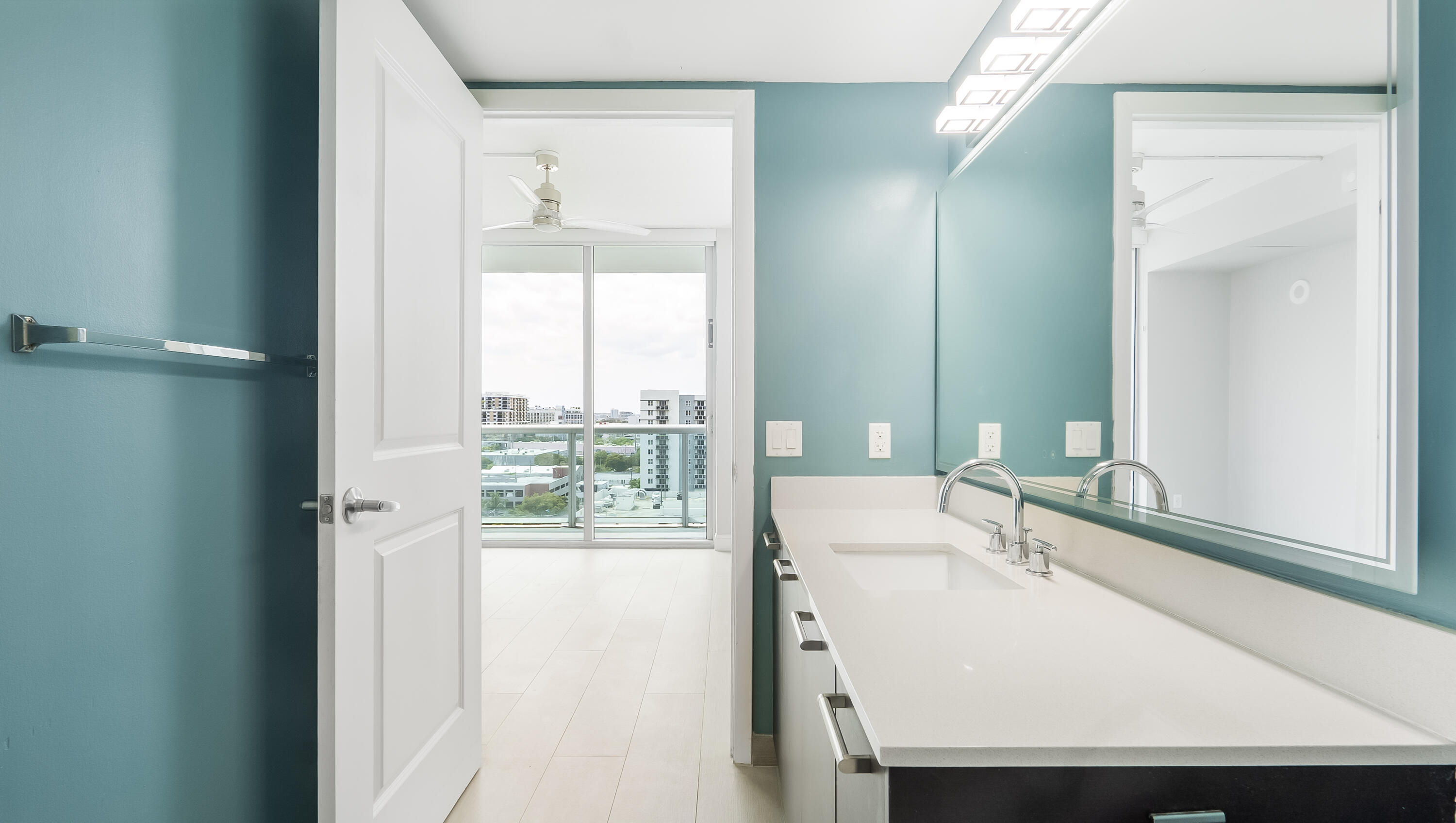 333 Northeast 24th Street, Unit 1102 Miami, FL 33137 - Photo 23 of 51 a bathroom with a sink and a large mirror