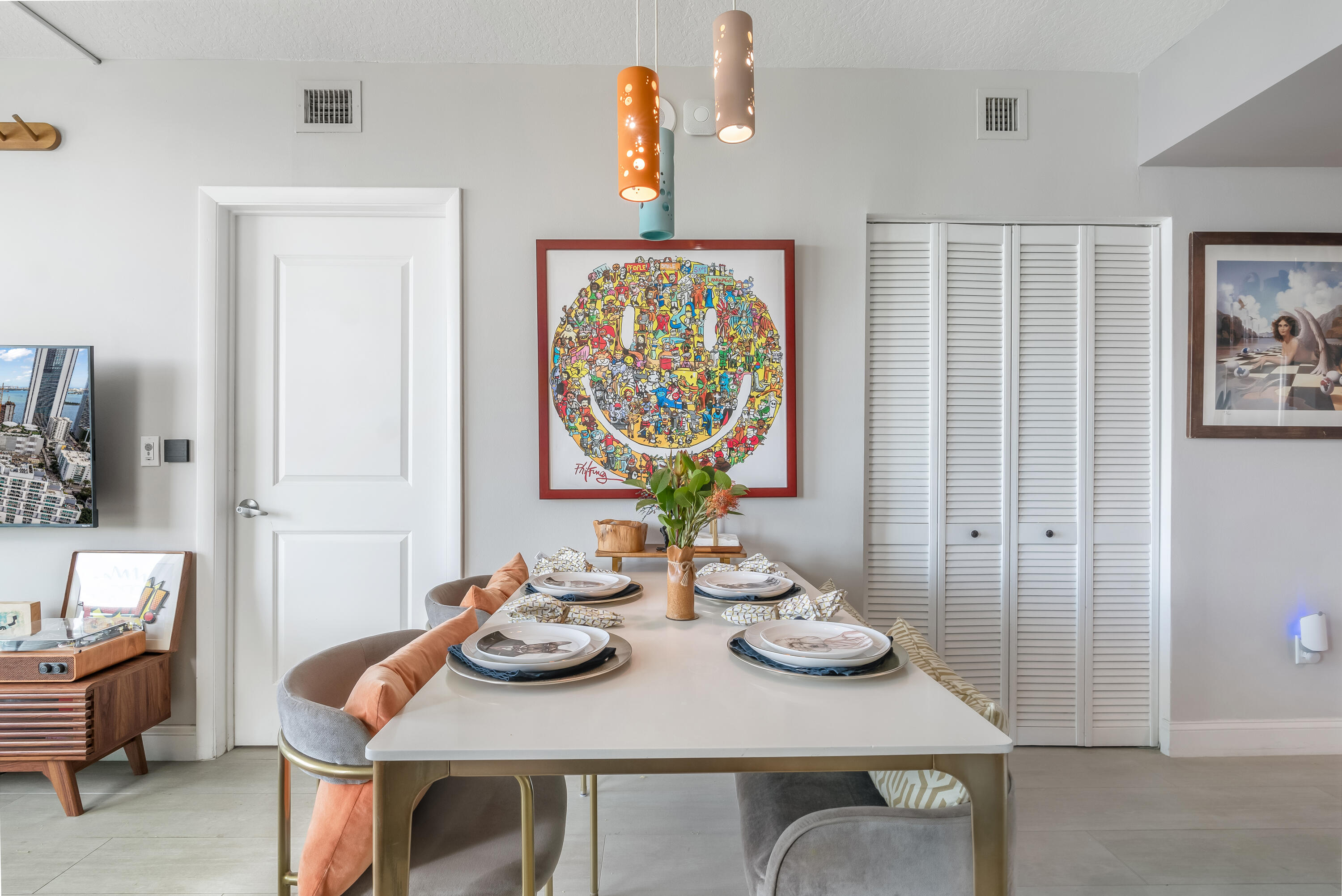 333 Northeast 24th Street, Unit 1102 Miami, FL 33137 - Photo 47 of 51 a view of a dining room with furniture a chandelier and wooden floor