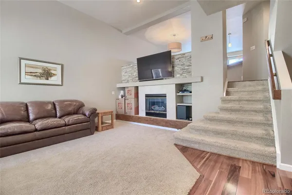 a view of a workspace with furniture and a living room