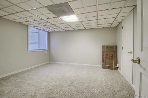 a white bath tub sitting next to a white toilet