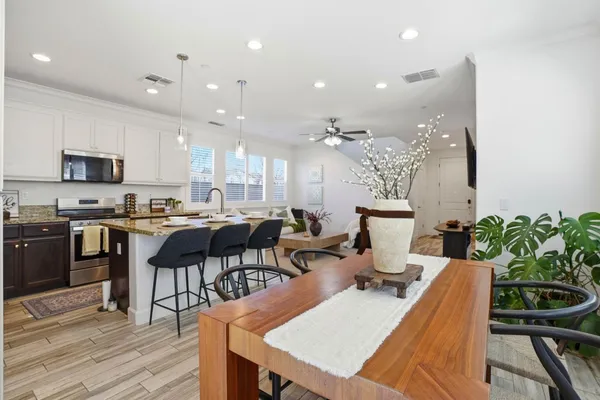 a kitchen with a table and chairs