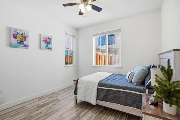 a bedroom with a bed and a window