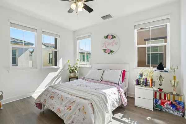 a bedroom with a bed and window