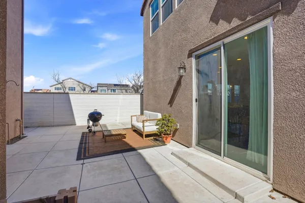 a view of living room with furniture and rug